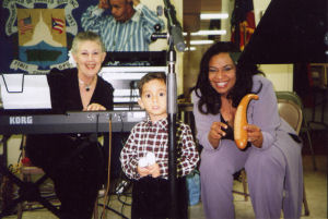Mari, audience member, and Anamer in children's show
